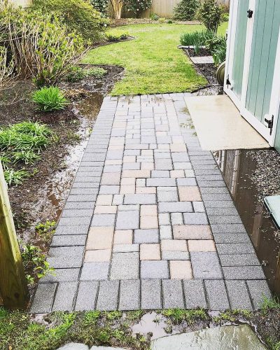 pavers after cleaning with grass and plants